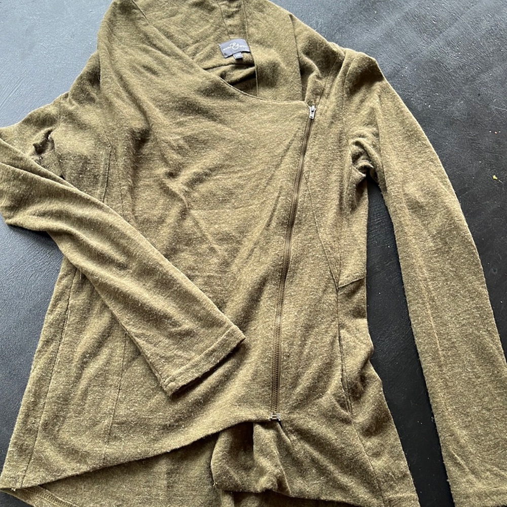 A symmetrical zip sweater